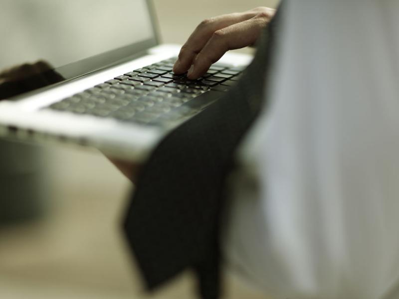 Hand on a laptop