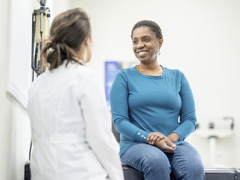 Smiling patient with physician