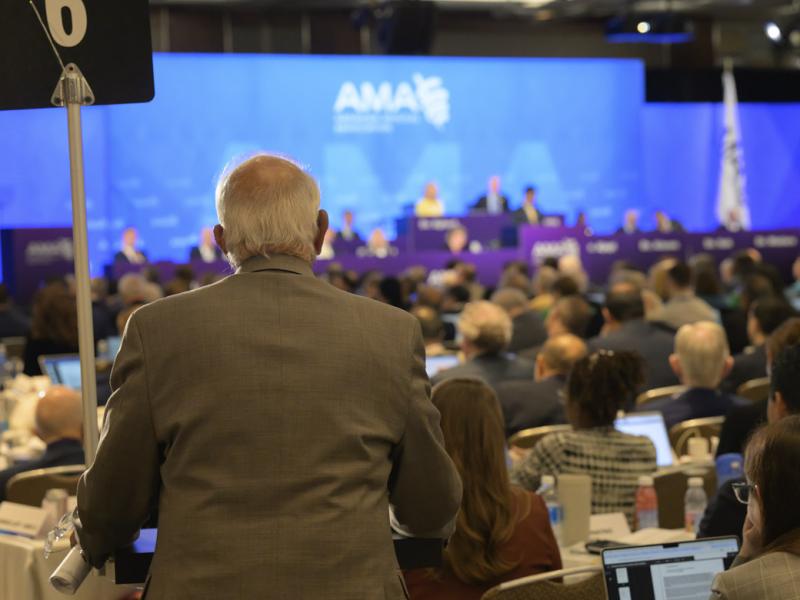 Delegate at the podium at the 2025 Annual Meeting of the HOD