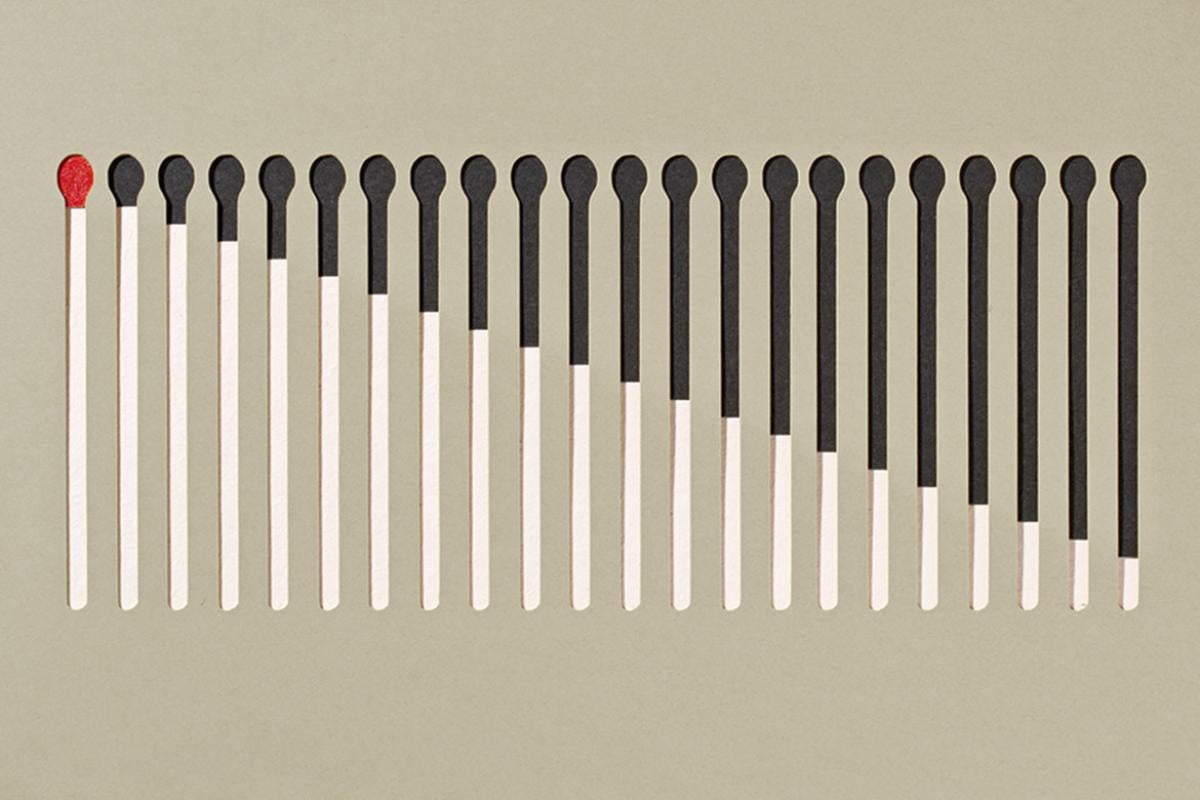 A row of matchsticks, each one progressively burned down
