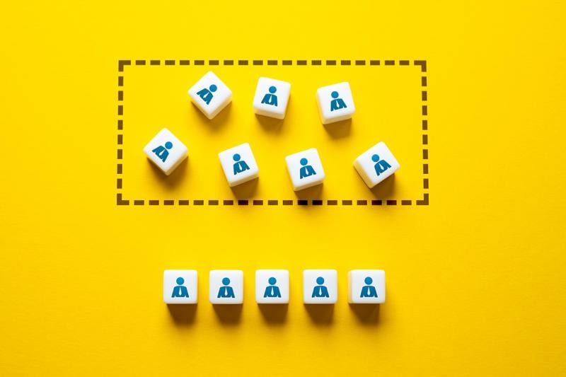 Blocks imprinted with figures wearing a tie